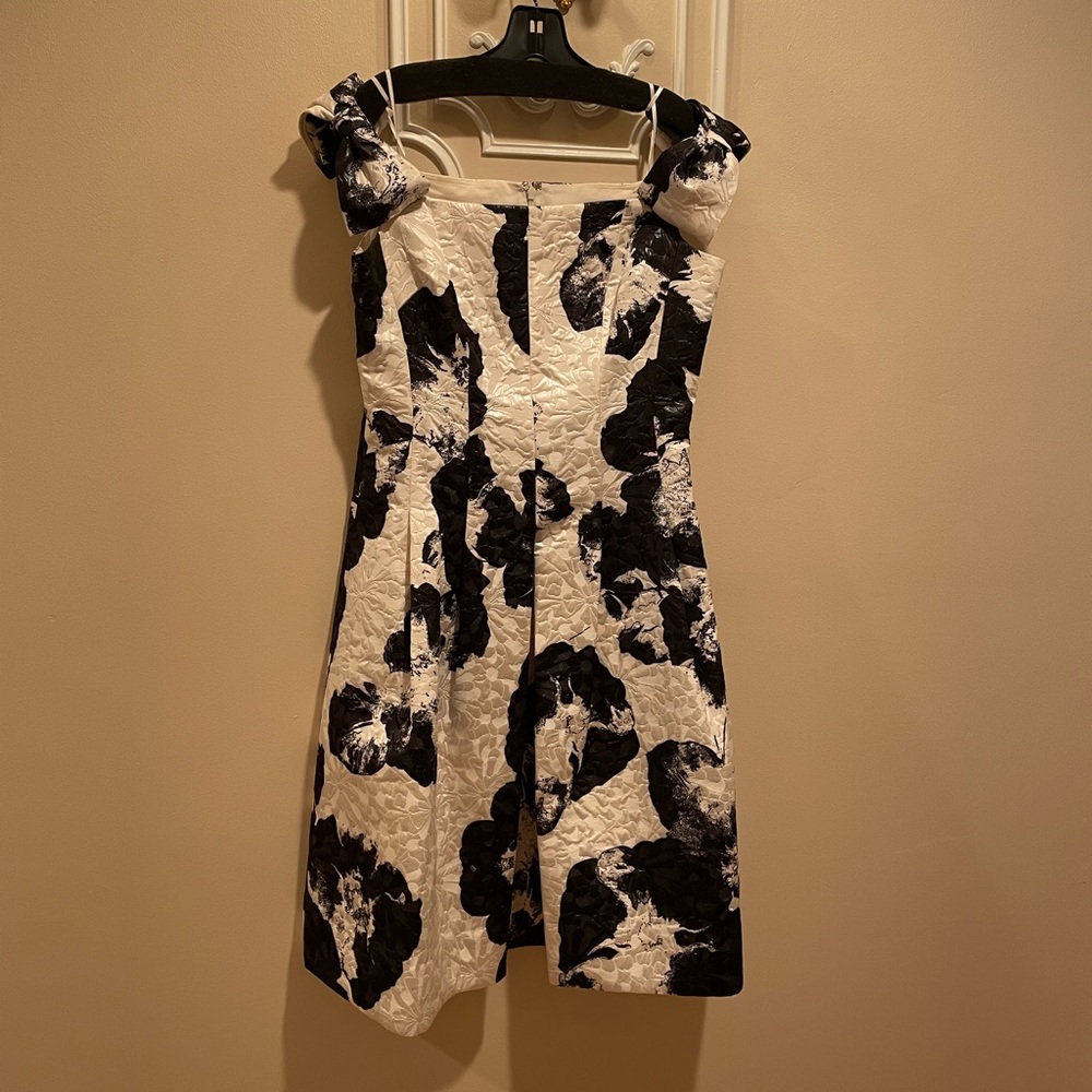 Fun afternoon or evening dress. Off the shoulder bows, fitted upper, big skirt